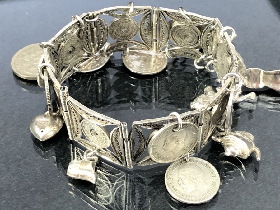 Collection of four silver and silver coloured metal bracelets some with silver coins and charms - Image 2 of 6