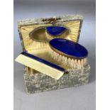 Boxed travel set of Brush and comb set with Blue enamel detaing and Brass frames, box (approx 11 x 7
