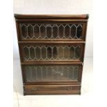 Four section early Globe Wernicke cabinet / book shelves with brass fitments, leaded glass and