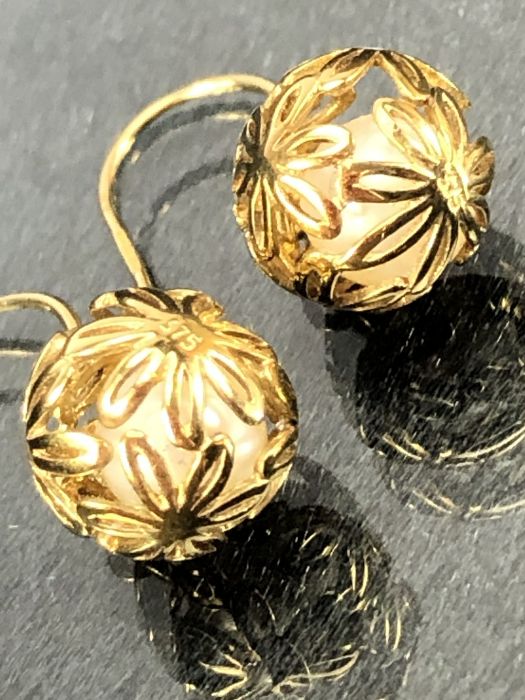 Pair of 9ct Gold earrings of delicate hollow gold balls set with diamonds and each encasing a - Image 3 of 4