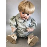 Johann Daniel Kestner bisque head character doll, with fixed blue eyes and open mouth, stamped JDK