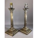 Pair of silver Victorian Corinthian column lamp bases with beaded rims, reeded columns and stepped