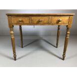 Stained antique pine hall table with three drawers on turned legs, approx 89cm x 49cm x 74cm tall