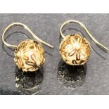 Pair of 9ct Gold earrings of delicate hollow gold balls set with diamonds and each encasing a