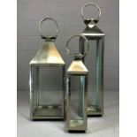 Set of three large contemporary storm lanterns, the largest approx 93cm in height