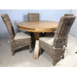 Light wood contemporary circular dining room table on three solid wooden legs, approx 120cm in