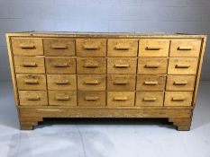 Haberdashery counter with 24 drawers, glass top and carved handles, with Art Deco style feet, approx