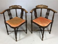 Pair of Edwardian corner chairs on turned legs with cross stretchers