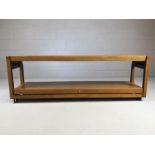 Mid Century metamorphic sideboard / coffee table, has either two tiers or extends to create one