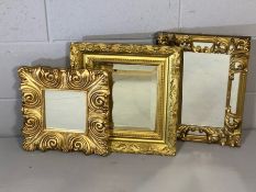 Collection of three gilt framed decorative mirrors, the tallest approx 42cm x 31xm