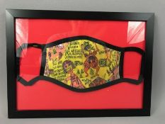 GRAYSON PERRY (b1960) Framed ‘We shall catch it on the Beaches’ face covering, approx 23cm x 32cm