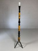 Retro turned wooden and lacquered lamp stand depicting antelopes on tripod feet