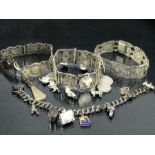 Collection of four silver and silver coloured metal bracelets some with silver coins and charms