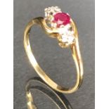 9ct Gold ring set with Garnet and diamond shoulders size 'R'