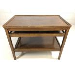 Interesting oak serving table / coffee table with detachable tray to base and extending trays to the