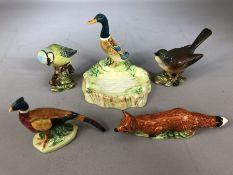 Collection of four pieces of Beswick to include pheasant, fox, blue tit, whitethroat and duck