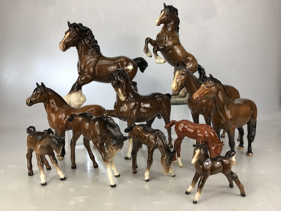 Collection of 11 Beswick horses of varying heights, to include New Forest Pony, rearing Welsh Cob,