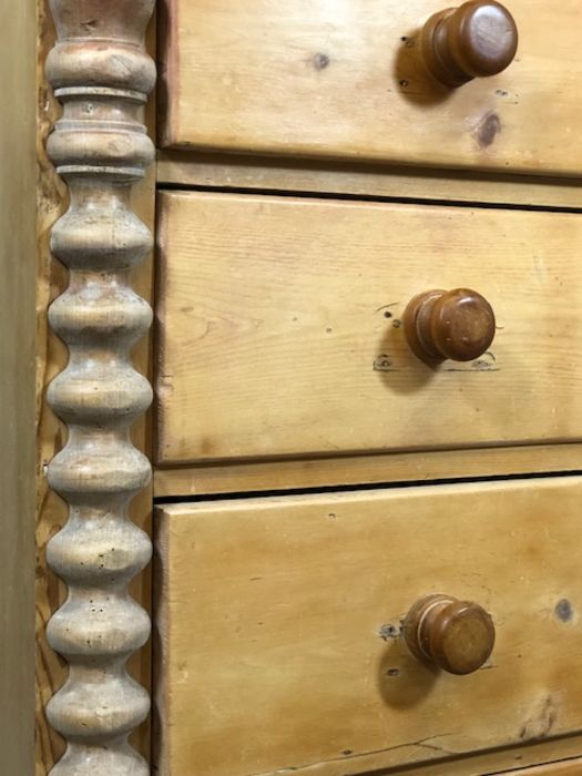 Pine chest of five drawers with turned columns to side on bun feet, approx 57cm x 115cm x 112cm - Image 5 of 5