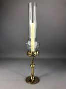 Arts and Crafts brass candle stick with glass shade, approx 42cm in height