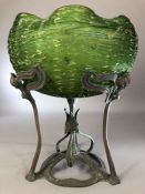 Art Nouveau green glass bowl with crinkled rim elevated on a copper stand with leaf design in the