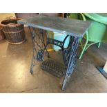 Singer sewing machine iron pedastal base with a slate top to create a vintage table