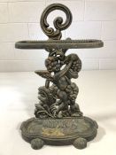 Wrought iron stick / umbrella stand depicting a winged cherub, approx 60cm tall