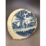 Antique Chinese bowl or tile depicting a garden scene two blue lines to reverse of irregular shape