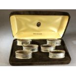 Boxed set of six silver hallmarked napkin rings in presentation case