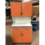 Retro Mid Century kitchen cabinet with orange paint finish, larder cupboard to top, two drawers