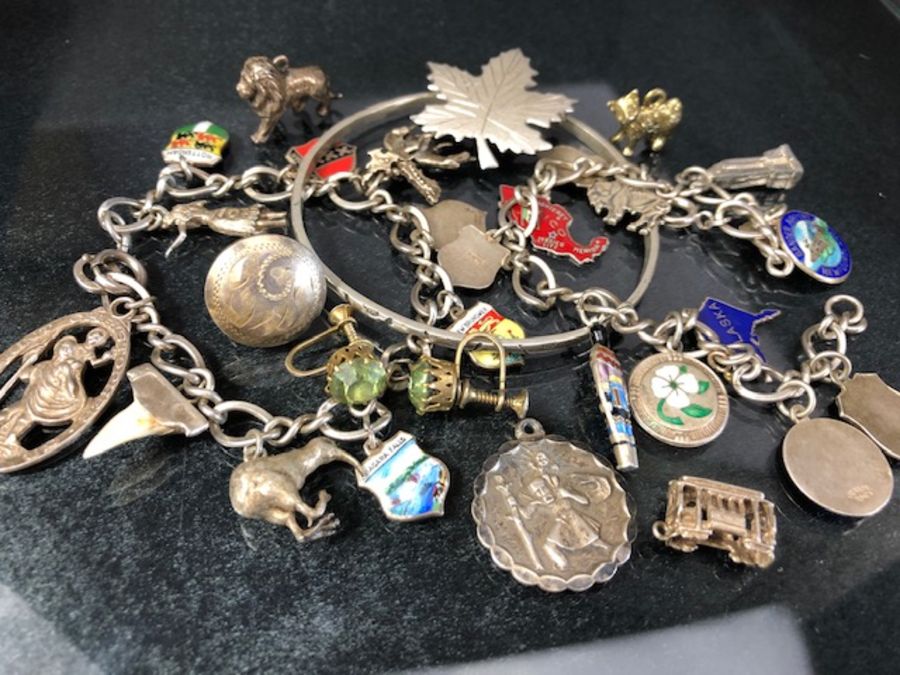 Collection of silver items to include two charm bracelets