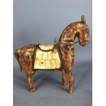 Tang Style carved wooden horse with brass detailing to ears, tail and saddle, the saddle with bone