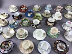 Large collection of porcelain cabinet cups and saucers to include examples by Doulton, Coalport,