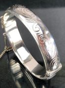 Silver hallmarked christening bangle decorated with floral sprays approx 20g