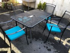 Modern metal garden table and four chairs with new seat cushions, table approx 130cm x 80cm x 71cm