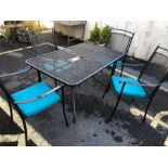 Modern metal garden table and four chairs with new seat cushions, table approx 130cm x 80cm x 71cm