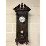 Wooden cased Vienna wall clock with pendulum and key, approx 94cm in height