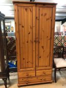 Pine two door wardrobe with two drawers under, approx 85cm x 52cm x 180cm tall