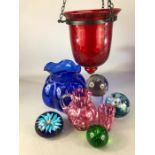 Collection of glass items to include red bubble glass lantern, paperweights etc