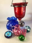 Collection of glass items to include red bubble glass lantern, paperweights etc