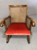 Small childs Oak frame and rattan chair with red velvet seat