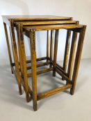 Delicate oak nest of three tables with carved detailing to legs