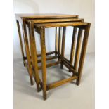 Delicate oak nest of three tables with carved detailing to legs