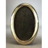 Oval Silver hallmarked Photoframe with wooden back (hallmarks indistinct) approx 15cm tall