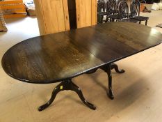 Extending dining room table on twin pedestal legs, approx 200cm in length (extended)