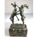 Pair of French Bronze fighting/ Boxing Hares on marble base with a foundary plaque with initials J.B