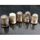 Five hallmarked silver thimbles