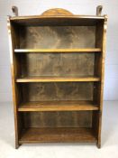 Oak bookcase in the Arts and Crafts style with four shelves, approx 74cm x 121cm x 28cm deep