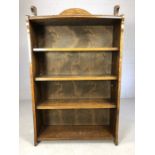 Oak bookcase in the Arts and Crafts style with four shelves, approx 74cm x 121cm x 28cm deep