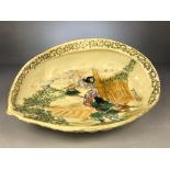 Japanese Meiji bowl in the form of a shell on two feet depicting warriors and signed approx 31cm