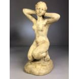 Sculpture: a plaster figure of a kneeling naked lady approx 34cm tall